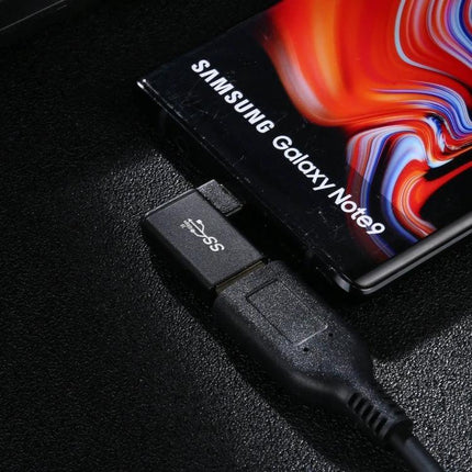 Type-C to USB Adapter with Right-Angle for Device Connectivity shown connecting a Samsung Galaxy Note9 in tight space for charging and file transfer