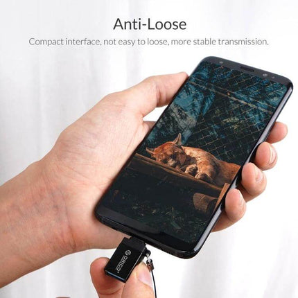 Orico Type-C to USB Adapter for Connecting Devices Easily shown plugged into smartphone demonstrating OTG mouse and keyboard support