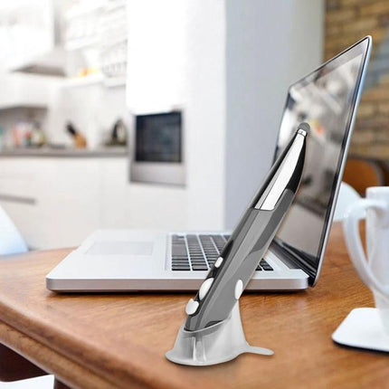 Wireless Optical Mouse with Stylus Pen for Tablets and PCs placed on desk beside laptop showing compact dual-function design for professionals and students