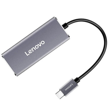 Lenovo USB-C to Gigabit Ethernet Converter for Laptops plugged into USB-C laptop port, compact gray adapter for reliable wired network