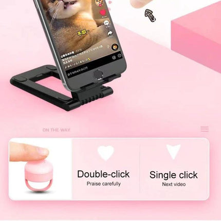 Bluetooth Fingertip Controller for Smartphone Video Apps on phone stand showing single click next video and double-click controls