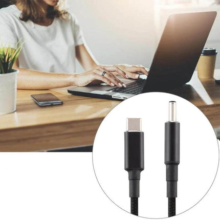 USB-C Charging Cable Adapter for 4.5x3.0mm Devices black braided cable next to laptop for travel and commuting