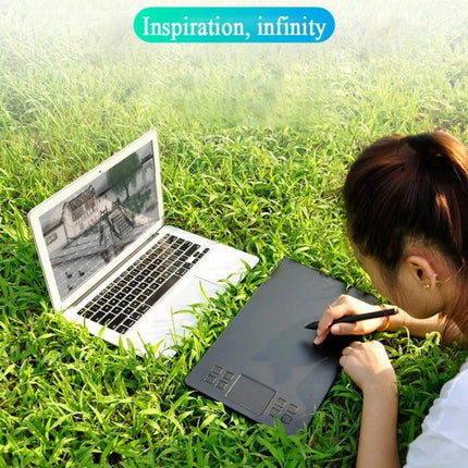 Veikk A50 10x6 Inch Graphic Tablet for Digital Drawing - artist using tablet and pen with laptop outdoors on grass