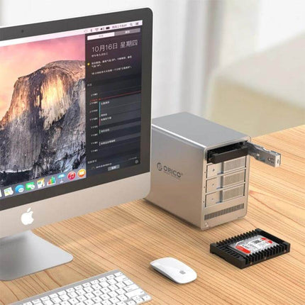 Orico 2.5 to 3.5 Inch Hard Drive Adapter for Computers shown installed in desktop bay next to iMac and 2.5-inch SSD