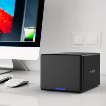 ORICO 5-Bay USB-C External Hard Drive Enclosure for Data Storage on desk next to monitor, tool-free magnetic door, LED indicator
