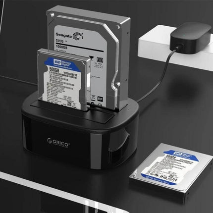 ORICO External Hard Drive Dock with Cloning for 2.5/3.5 Inch Drives showing two HDDs and one SSD docked for cloning and backup