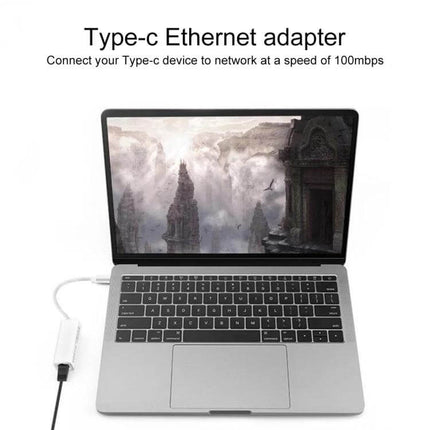USB-C Ethernet Adapter for Reliable Network Connections - USB-C to Ethernet adapter connected to laptop for stable wired internet