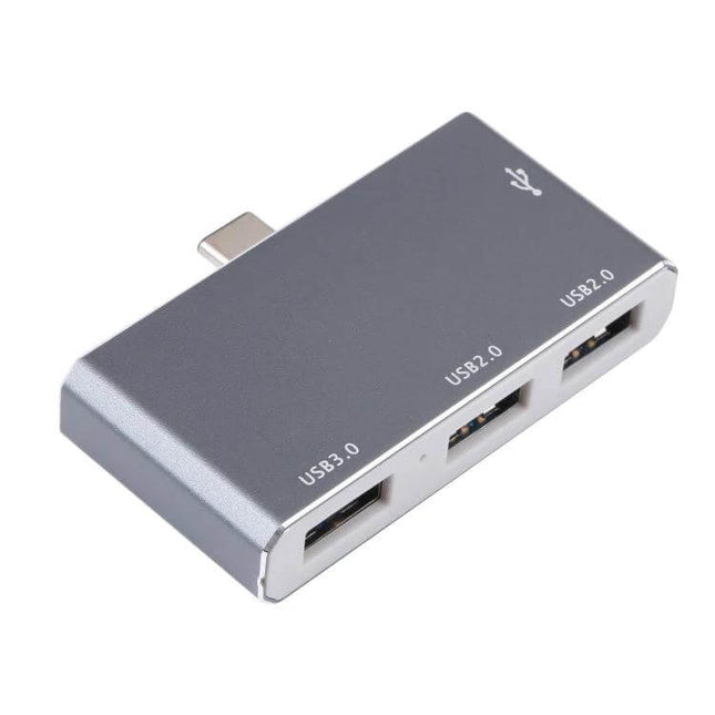Compact Portable USB-C 4-Port Hub for Laptop Connectivity – slim gray USB-C hub with one USB3.0 and two USB2.0 ports for laptops and travel