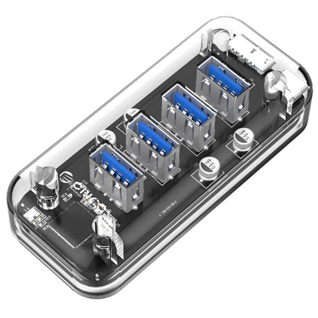 Orico Desktop USB Hub with 4 Ports and Blue LED Indicator Light showing transparent body and four USB ports on desk