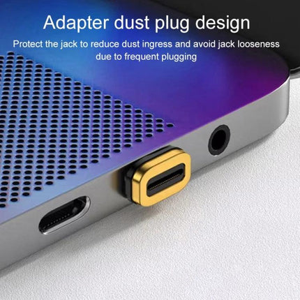 Magnetic Elbow Adapter for Everyday Device Charging and Transfers shown as gold Type-C dust plug on a laptop port to prevent bending and dust ingress