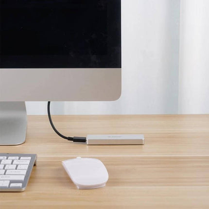 Orico Enclosure for M.2 SSD Storage via USB-C, Up to 2TB Capacity connected to desktop for fast portable storage
