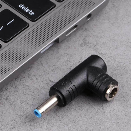 HP DC Power Adapter Converter with 4.5mm Male to 5.5mm Female Connector - right-angle black adapter next to laptop port