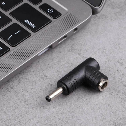 DC Power Adapter: 4.0mm Male to 5.5mm Female Connector placed next to laptop for connecting mismatched DC plugs