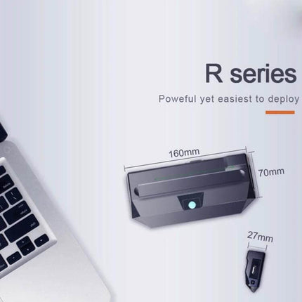 R1 Compact Mini PC for Everyday Home Computing Tasks showing compact 16x7x2.7cm plastic shell next to laptop for space-saving monitor mount