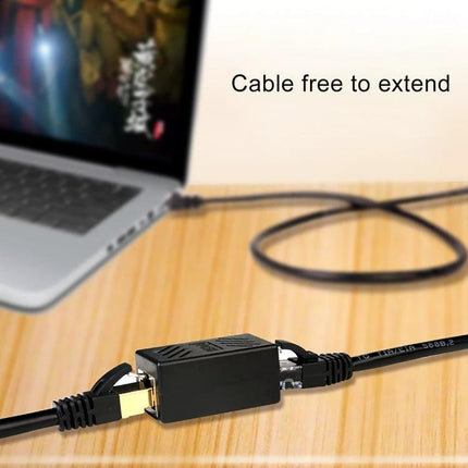 RJ45 Straight-Through Connector Pair for Cable Extension joining two Ethernet cables on a desk between laptop and cable