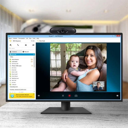 High-Definition USB Webcam with Microphone for Video Calls showing a computer monitor with a clear 1080P video call image of a woman holding a baby