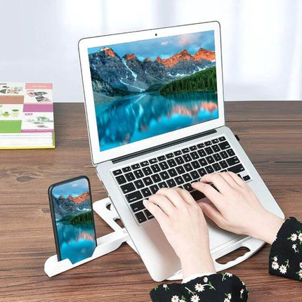 Laptop Cooling Stand with Adjustable Phone Holder for Daily Use showing laptop elevated with phone in holder and hands typing