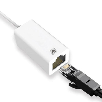 Compact Ethernet Adapter for iPhone Home Networking Use — white compact adapter with RJ45 cable plugged in for stable wired connection