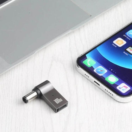 Compact USB-C Charging Adapter for HP Laptops and Computers shown next to a laptop and smartphone, compact travel-friendly USB-C power adapter