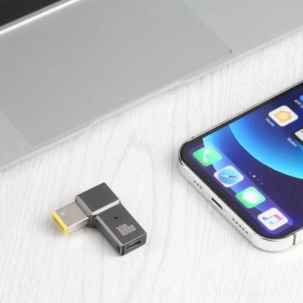 100W USB-C to Big Square Charging Adapter for Lenovo Computers compact 100W USB-C square adapter next to laptop and phone for travel charging
