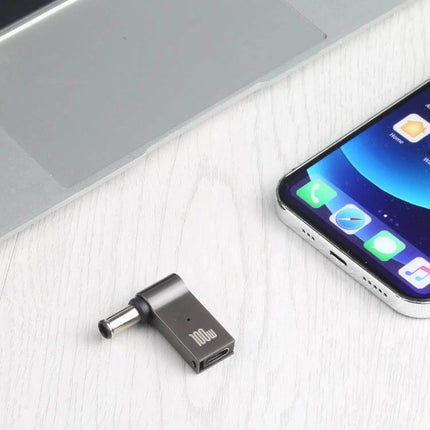 Portable USB-C to DC Charging Adapter for Sony Laptops and Devices shown next to laptop and smartphone, 100W USB-C to 6.0x1.4mm DC male adapter