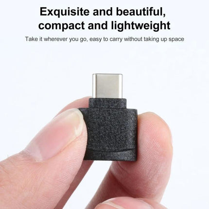 Compact USB-C Adapter for Daily TF Card Access on Devices - compact lightweight plug-and-play TF card reader held between fingers
