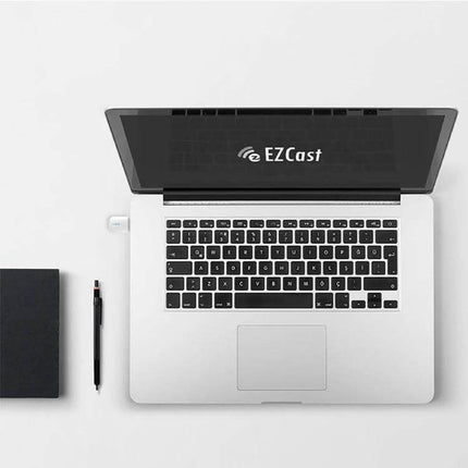 EZCast Dual Band Wireless Adapter for WiFi and Bluetooth Connectivity plugged into a laptop USB port for streaming and Bluetooth device use