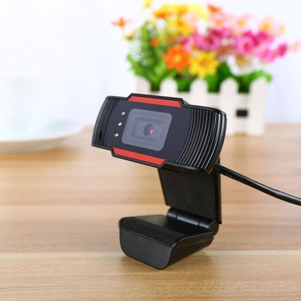 Versatile Orange Webcam with Integrated Microphone for Daily Video Calls on desk, clip-on mount, adjustable angle and low-light LEDs