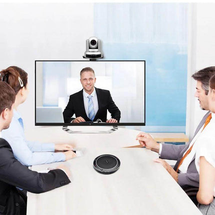 YANS Wireless Omnidirectional Microphone for Video Conferences placed in a small meeting room capturing 360-degree clear voice pickup