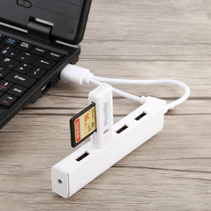 Multi-Port USB Hub for Connecting Devices with USB-C Ports connected to laptop with USB flash drive and SD card, white compact hub