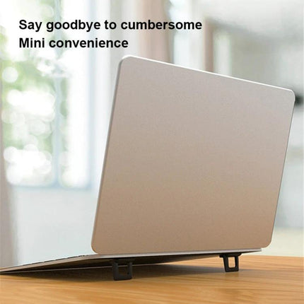 Foldable Mini Desktop Holder for Everyday Use, 2-Pack holding a laptop upright on a wood desk, showing compact foldable stands for travel and home office