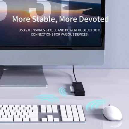 Orico 4-Port USB 2.0 Hub for Connecting Multiple Devices Easily shown plugged into desktop with keyboard and mouse connected