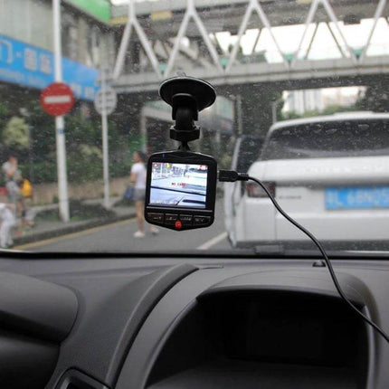 Car Camcorder with 2.4 Inch LCD Screen for Driving Recordings mounted on windshield capturing road footage for commutes and trips