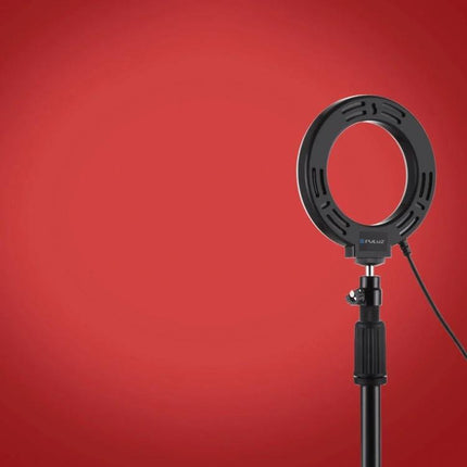 PULUZ Ring Light for Daily Vlogging and Selfies at Home on stand against red backdrop, compact ring light for flattering video and selfies