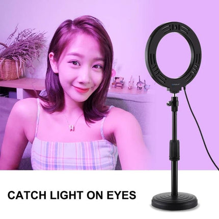 PULUZ LED Ring Light for Daily Vlogging and Home Photos showing woman taking a bright selfie with ring light and adjustable stand