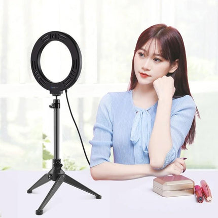 PULUZ LED Ring Light for Daily Vlogging and Home Photos on tripod beside woman doing home vlog setup