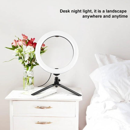 PULUZ LED Ring Light with Tripod for Daily Vlogging Sessions on bedside table with flowers and open tripod, portable lighting for tutorials and social media