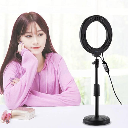 Essential PULUZ Ring Light for Home Vlogging Sessions on desk with woman vlogger, 28 LED beads, adjustable stand and soft even lighting