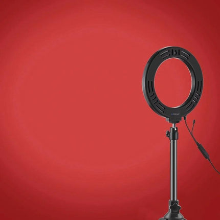 PULUZ Ring Light for Daily Video Calls and Home Photos on tripod against red backdrop, LED ring with cable