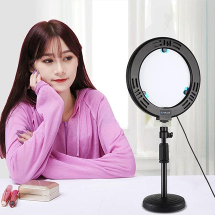 PULUZ LED Ring Light for Home Vlogging and Selfie Sessions on desk tripod illuminating a creator for selfies and home vlogs