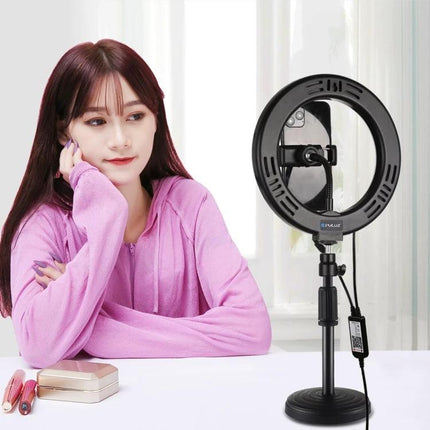 PULUZ Ring Light for Daily Video Chats and Photos on adjustable stand illuminating a woman at a desk