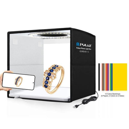 PULUZ 25cm Folding Portable Photography Tent Box for Small Items showing ring photographed with even lighting and backdrops