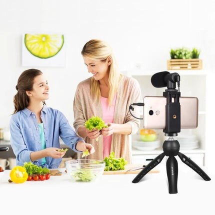 Essential PULUZ Kit for Everyday Smartphone Vlogging Sessions - compact tripod, phone clamp and mic capturing a mom and daughter cooking vlog