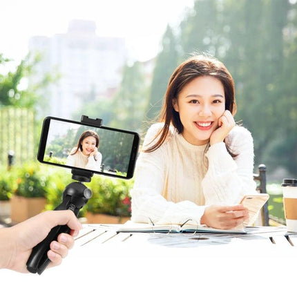 Essential PULUZ Kit for Everyday Smartphone Vlogging Sessions - woman vlogging outdoors with tripod mount, phone clamp and external mic for steady footage
