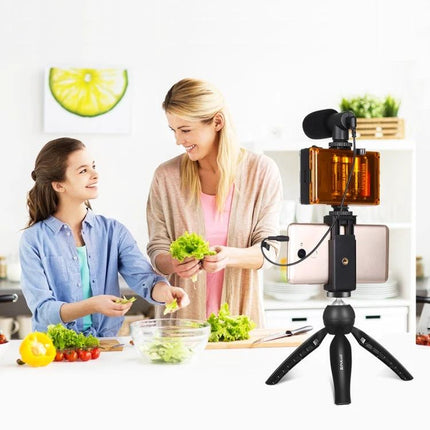 PULUZ Everyday Vlogging Kit with Essential Mobile Accessories shown recording a mom and daughter cooking with tripod, microphone, and fill light