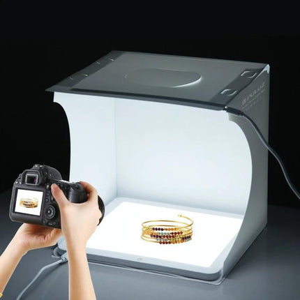 PULUZ 30cm Folding Light Box for Small Product Photography capturing a gold bracelet with DSLR on a tabletop setup