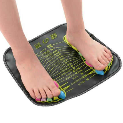 PP Foot Reflexology Pad With Quadrate Stones For Foot Massage 35x35cm placed on floor with feet demonstrating toe separators and raised square stones for home reflexology