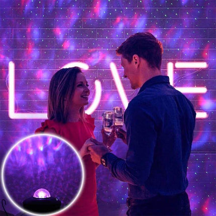 Water Ripple Laser Star Projector With Bluetooth Music casting purple water ripple and green stars over couple celebrating with wine