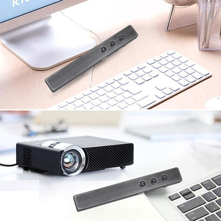 Wireless PPT Presenter Remote with Laser Pointer and Air Mouse Function showing remote beside keyboard and projector for presentations