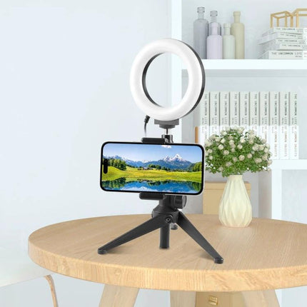 PULUZ Handlebar Phone Mount for Bicycle Use and Photography mounted on tabletop tripod with smartphone and ring light for hands-free photos